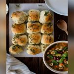Keto homemade dinner roll-ups baked golden with cheesy, savory filling inside.