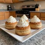 Ultimate keto cream puffs filled with sugar-free vanilla cream — low-carb choux pastry dessert on a plate.