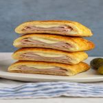 “Keto Hot Pockets made with golden low-carb dough, stuffed with melted cheese and savory fillings.”