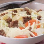 Keto smoky cheeseburger salad with seasoned beef, cheese, and fresh vegetables