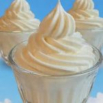 Smooth keto cheesecake fluff piped into glass dessert cups