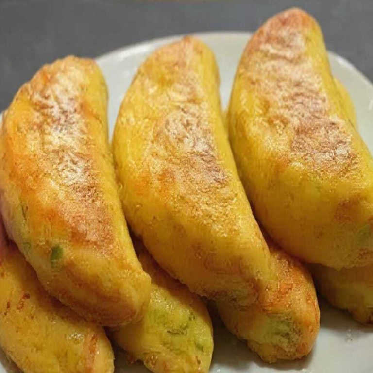 Crispy golden keto cabbage and egg fritters on a white plate